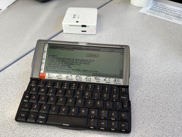A Psion 5mx using the local ChatGPT web app with RetroModem in the background
